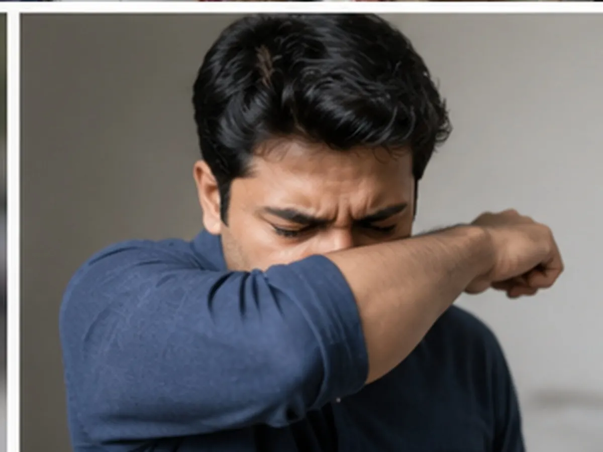 Coughing into a bent elbow — correct cough and sneeze etiquette