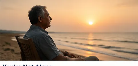 Man sitting calmly by the sea at sunset